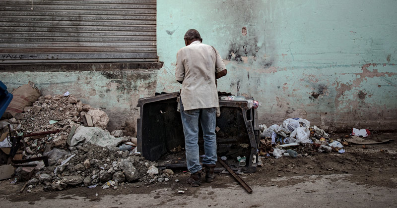 Man picking through garbage