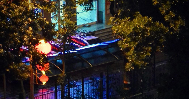 Red lanterns hang from street lights on Tuanjie Lu (Timothy Grose)